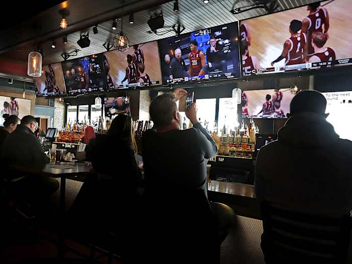 Patrons take in the tournament from a bar in Indy
